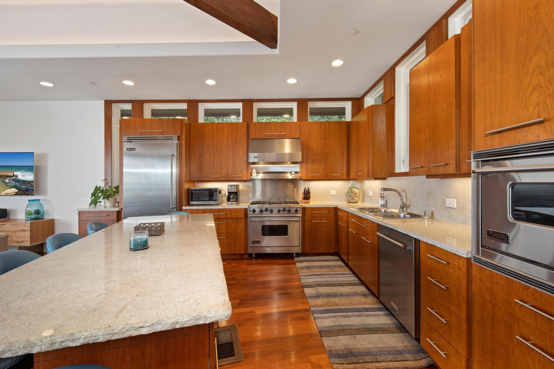 Viking-equipped kitchen with wood cabinetry and large island